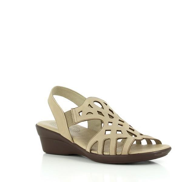 The sandal is positioned at a slight angle, capturing the side profile and front detailing. The curve of the 4.5 cm heel-platform height is visible, along with the transition from the leather upper to the sturdy synthetic sole. The slingback strap with elastic is also highlighted, showcasing its adjustability.