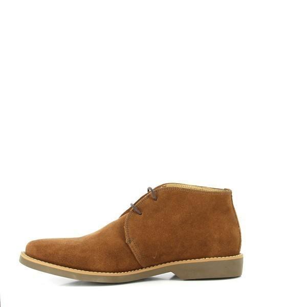 The internal side of the boot showcases the plush genuine sheepskin lining, demonstrating its soft and breathable quality. This lining enhances the overall comfort and ventilation of the shoe.