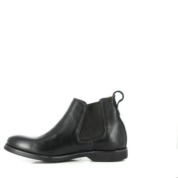 The internal side of the Anatomic Fabio Black Ankle Boots is visible, featuring the soft sheepskin lining and cushioned footbed. This view highlights the comfort and premium materials used inside the boot, with the patented antibacterial layer subtly shown.
