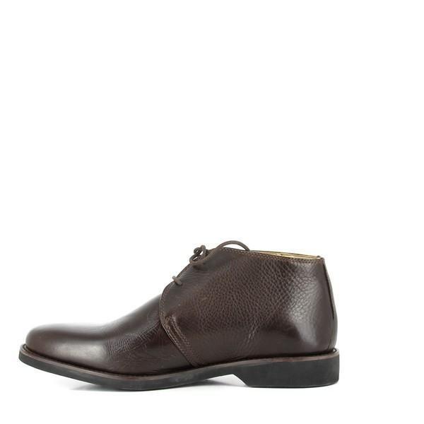 The internal side view reveals the plush sheepskin lining and the cushioned footbed with dual layers of foam and latex. The antibacterial layer underneath enhances breathability and moisture management.