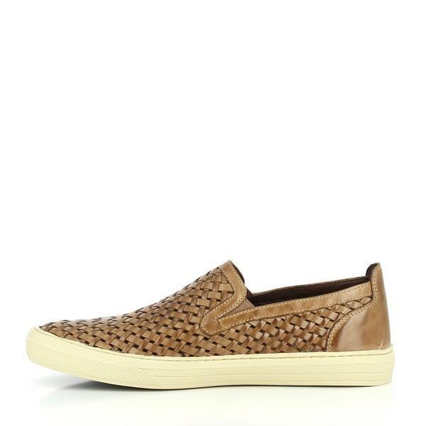 A close-up of the interior side, revealing the soft sheepskin lining and cushioned footbed designed for breathability and comfort.