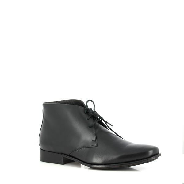 From an angled perspective, this image showcases the Anatomic Panorama boots' refined silhouette and detailed craftsmanship. The burnished leather and lace-up closure are highlighted, along with the comfortable heel height and the boot’s structured profile, demonstrating the blend of style and practicality.
