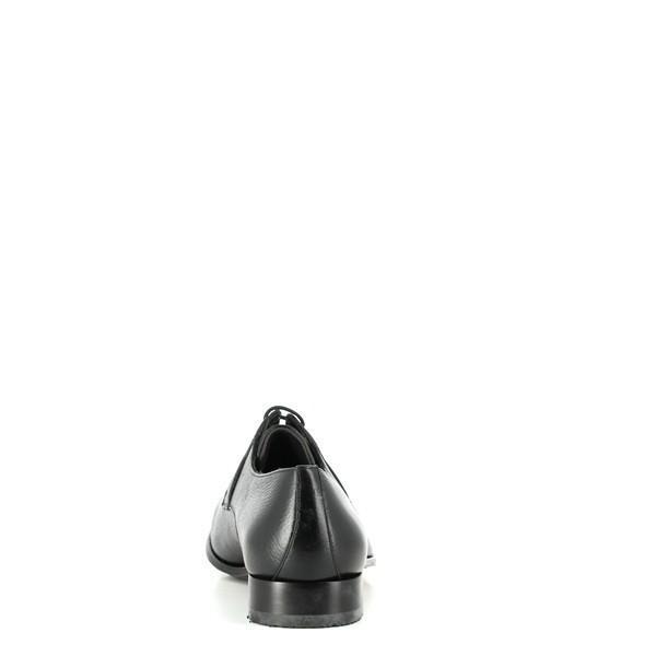 The back view of the shoe highlights the smooth leather upper and the minimalist heel. The soft leather welts and the subtle stitching provide a glimpse of the detailed craftsmanship.