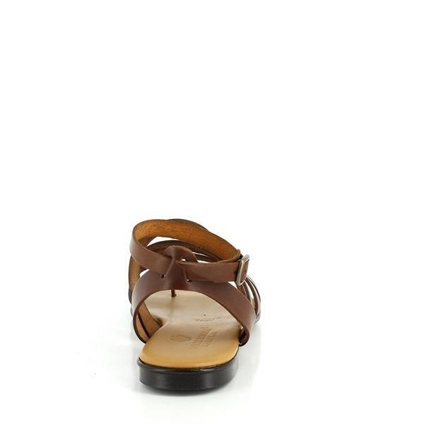 The rear of the sandal displays the slingback strap encircling the heel, with the small buckle fastening securely. The smooth leather back strap, slightly tapered for comfort, flows seamlessly into the synthetic sole. The tan hue complements the entire design, while the visible stitching along the edge speaks to the impeccable craftsmanship of the Italian-made sandal. The low-profile heel completes the minimalist yet sophisticated look.