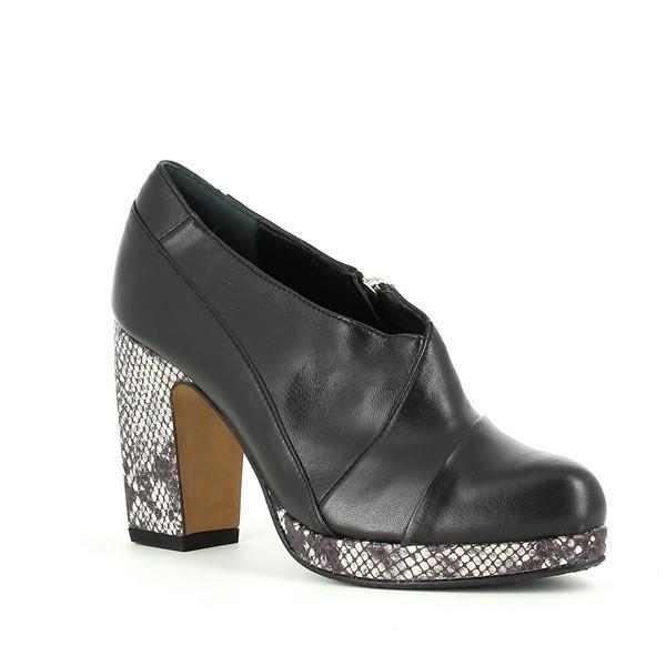 From this angle, the booties reveal their stunning profile, highlighting the 10cm high heel that offers a glamorous lift. The combination of smooth leather and textured snake print creates a captivating contrast, while the curved lines of the booties emphasize their chic and contemporary design.