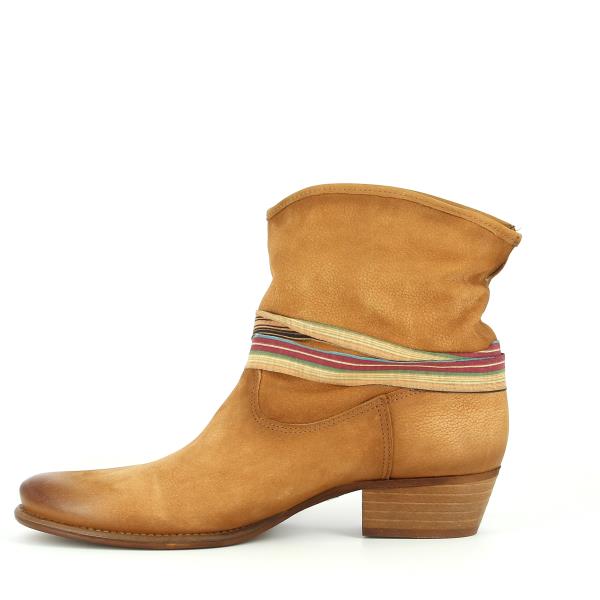 A view of the inner side, revealing the soft lining material and the structured shape of the boot. The interior is designed for comfort and durability.