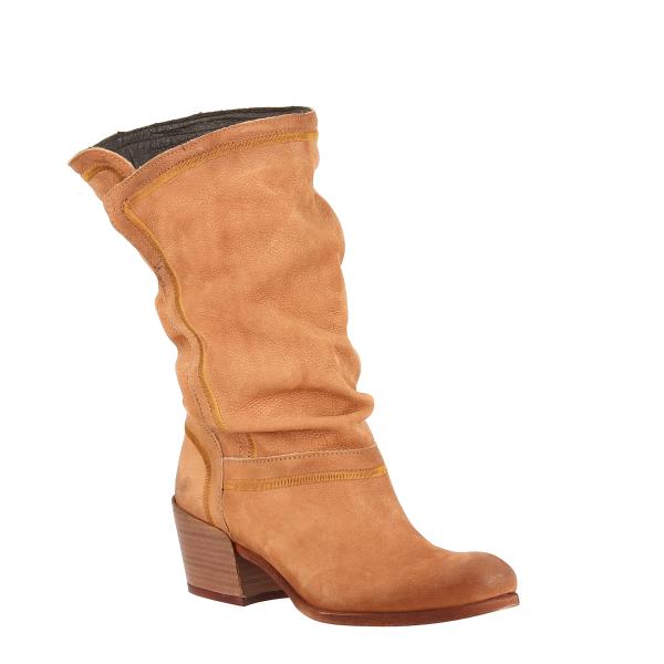 This angled shot showcases the transition from the gently rounded toe to the knee-high shaft, highlighting the handcrafted wrinkled detailing. The sturdy sole and slightly tapered heel add a contemporary touch, while the natural leather sheen reflects the boot's artisanal quality.
