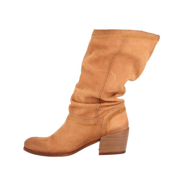 A closer look at the inner side emphasizes the functionality of the boots, featuring a concealed zipper that blends seamlessly with the leather. The soft leather lining is visible, promising comfort and breathability, while the stitching details underscore the boot's meticulous craftsmanship.