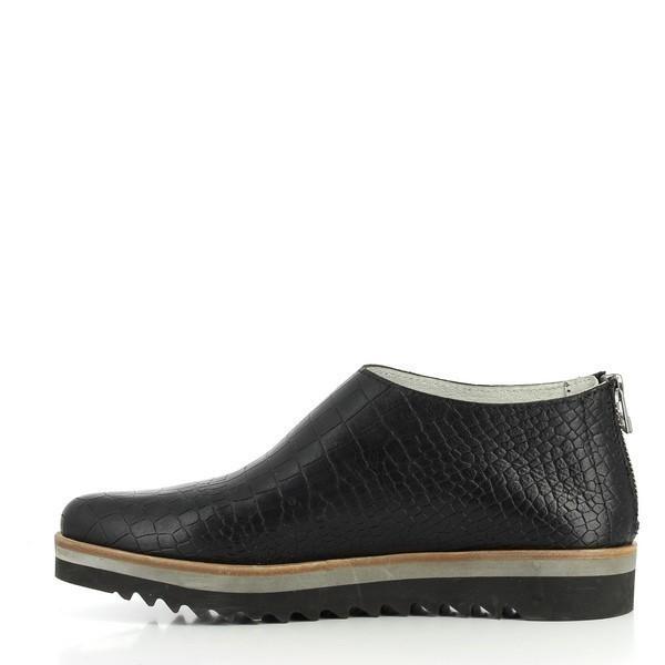 A closer look at the inner side of the shoe, highlighting the smooth leather finish, precise stitching, and the ergonomic design that ensures comfort.