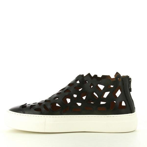 A close-up of the shoe's inner side, revealing the soft leather lining, the clean finish of the laser-cut patterns, and the ergonomic design for a snug fit.