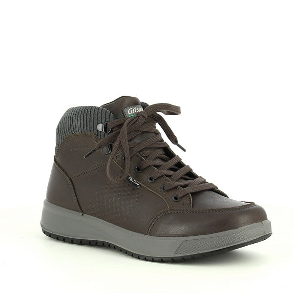 A dynamic angle capturing the front and side of the boot, highlighting the round toe shape, secure laces, and smooth leather finish.