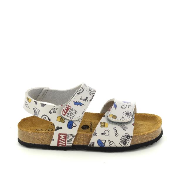 A side view of Plakton's 125459 Rock Kids Sandal, showcasing the stylish leather upper adorned with rock and roll motifs. The cork sole with a 2cm platform and the adjustable double straps are visible, highlighting the sandal's durability and practical design.