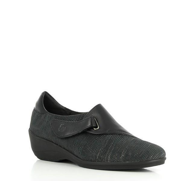 The sneaker is shown at a slight angle, highlighting the 4 cm heel-platform and the sleek silhouette. The angle captures the smooth leather texture and the practical design features, including the velcro fastener.