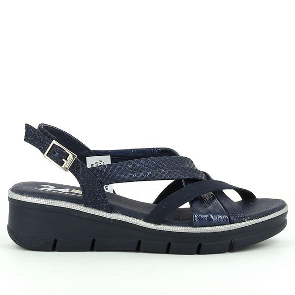 A pair of 24Hrs 24559 Blue Slingback Sandals is displayed against a neutral background. The sandals feature a vibrant blue leather upper with a smooth texture and a round toe shape. The leather lining adds a touch of luxury, while the 4.5cm heel provides a comfortable lift. The synthetic sole is visible, highlighting its durability and grip. The design includes a small, elegant buckle fastening, ensuring a secure and adjustable fit. The overall presentation showcases the sandals' stylish and versatile desig