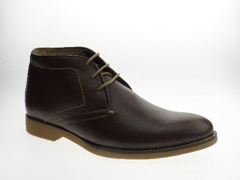 The Anatomic Barium Coffee Ankle Boots are shown from the side, highlighting their sleek silhouette and smooth, rich coffee-colored leather. The high-quality leather is soft yet durable, contributing to the sophisticated design of these men’s shoes.