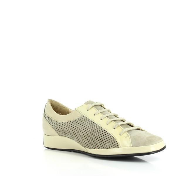 This angle captures the shoe from a slightly tilted perspective, offering a better look at the toe box and the smooth curvature of the shoe. The gold hue shimmers under the light, giving the sneaker an elegant, yet modern appeal.