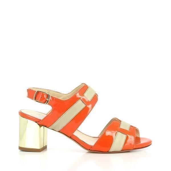 The photo showcases the Amalfi Pam Coral Slingback Sandals from the side. The coral and beige leather upper is elegantly complemented by a sleek golden heel, creating a sophisticated and vibrant profile. The slingback design enhances the shoe’s classic silhouette.