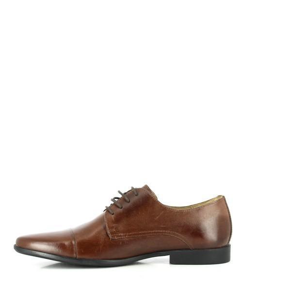The interior view of the Anatomic Amparo Brown Oxfords reveals the plush genuine sheepskin lining and the cushioned footbed. The photograph shows the soft, luxurious lining and the layers of foam and latex in the footbed, underscoring the comfort and quality of the shoe’s interior.






