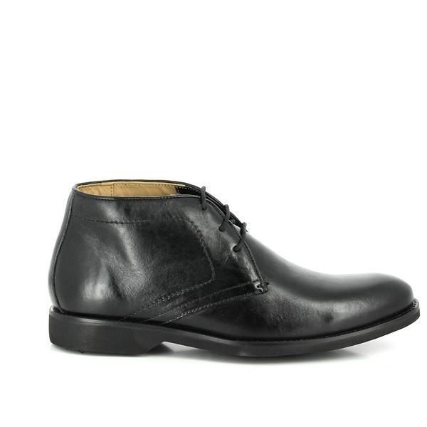This side view of the Anatomic Barium Black Ankle Boot showcases its sleek, streamlined design and smooth leather upper. The photograph highlights the clean lines and elegant silhouette of the boot, emphasizing its high-quality craftsmanship and the sophisticated burnished finish of the leather. The subtle curve of the boot and the well-defined stitching reflect the attention to detail and premium materials used in its construction.