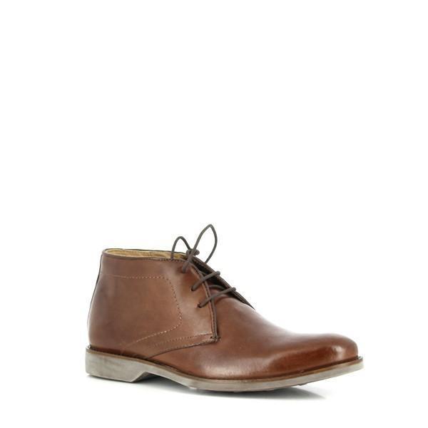This angled side view of the Anatomic Barium Coffee Ankle Boot showcases its refined, smooth leather upper and sleek design. The photograph highlights the elegant lines and burnished finish, capturing the sophisticated silhouette and meticulous craftsmanship of the boot.