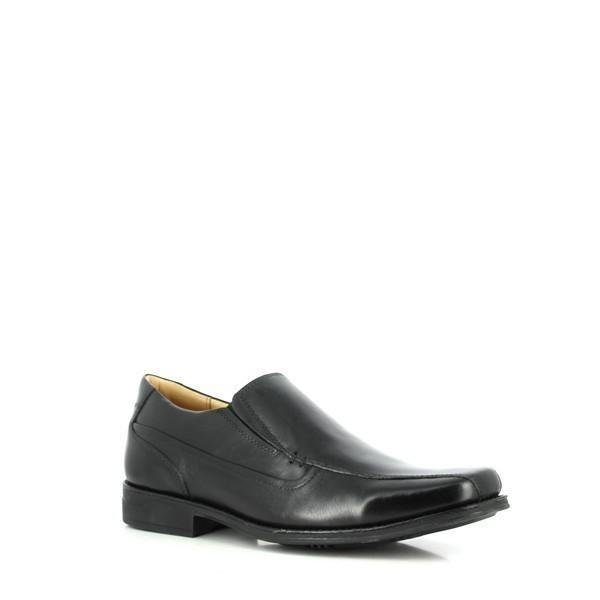 An angled view highlighting the shoe's curvature and elegant shape. The rich texture of the leather is evident, along with the precision of the handcrafted details. The shoe's natural rubber sole with a non-slip surface is partially visible.