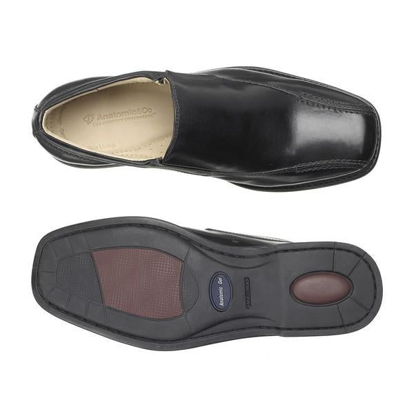 A top-down shot of the two shoes, with one placed upside down to showcase the sole. The intricate tread pattern of the sole is visible, emphasizing the non-slip surface and flexibility. The other shoe's cushioned footbed and soft sheepskin lining are visible, providing a clear view of the comfort-focused interior.
