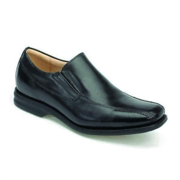 The shoe is angled to highlight its sleek design and smooth black leather upper. The square toe shape is prominent, along with the subtle burnished finish that adds depth to the leather. The natural rubber sole is partially visible, showcasing its flexibility and the refined stitching along the welt.