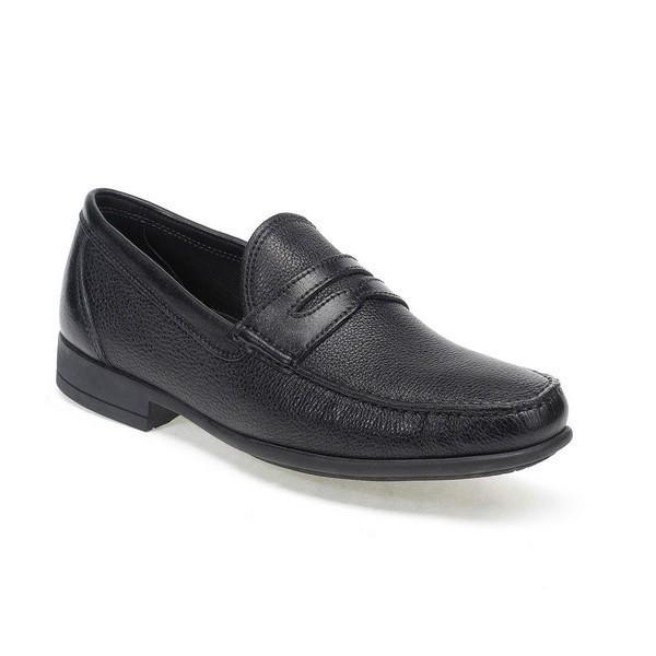 A close-up side view of the Anatomic Castelo Black Driver Shoe, showcasing the smooth, polished leather upper with its sleek, curved silhouette. The angle highlights the fine stitching and classic round toe design, emphasizing the shoe's refined craftsmanship.