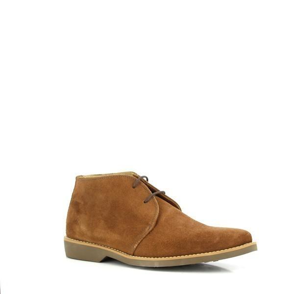 Shown from a slight angle, the boots reveal their refined silhouette and the luxurious texture of the tobacco leather. The cushioned footbed is subtly visible through the side, emphasizing the comfort and support provided.