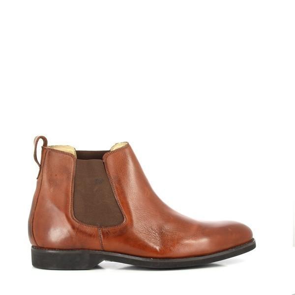 The Anatomic Fabio Chestnut Ankle Boots are shown from the side, highlighting their sleek design with smooth, full-grain leather. The rounded toe and subtle stitching details emphasize the boot's refined and elegant silhouette.