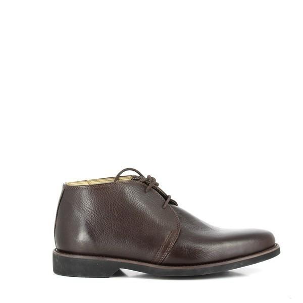 The side view of the Anatomic Jimmi Brown Lace-Up Boots showcases the smooth, full-grain brown leather upper. The classic lace-up design and round toe highlight the boot's refined, timeless style.