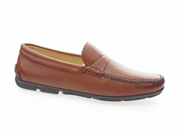 A side view of the Anatomic Kempt Tan Driver Shoes. The image highlights the smooth, full-grain leather upper with a rich, tan color and sophisticated burnished finish. The round toe shape is visible, along with the soft leather lining that enhances comfort. The flexible, non-slip sole, featuring the unique Anatomic Gel Technology®, is partially shown, indicating the shoes' excellent grip and durability. The overall view emphasizes the handcrafted quality and elegant design of these men’s shoes.