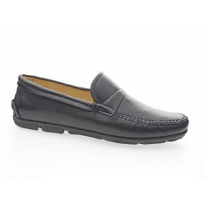 A side view of the Anatomic Kempt Black Driver Shoe, showcasing its smooth, supple black leather upper and the sleek, rounded toe design. The shoe's subtle stitching and low-profile heel can be seen, highlighting its elegant, minimalist style.