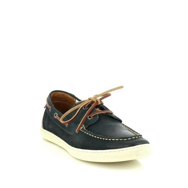 An angled perspective that emphasizes the sleek curves and supple texture of the indigo leather. This view also highlights the boat shoe's refined design and the sophisticated burnished finish, providing a glimpse of the shoe’s elegant contours.