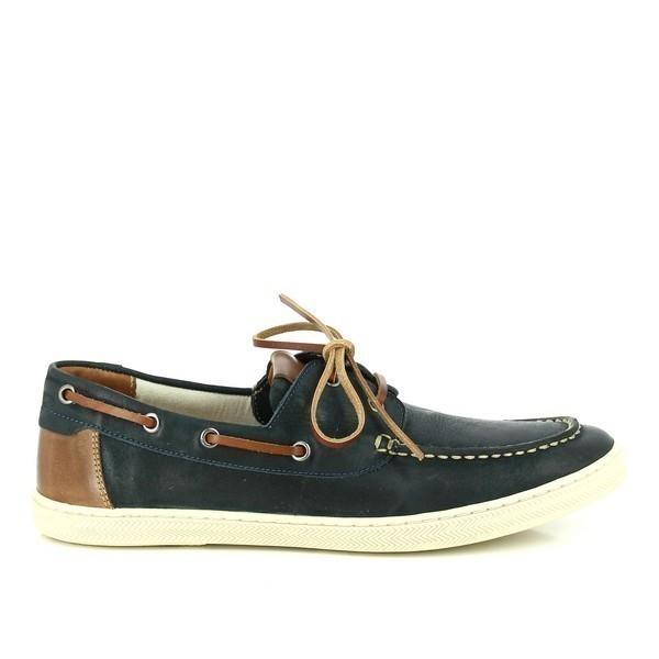 A side view of the Anatomic Lorena Indigo Pinhao Boat Shoes, showcasing the rich indigo leather upper with a smooth, polished finish. The classic boat shoe design is evident, with a rounded toe and detailed stitching that highlights the shoe's handcrafted quality.