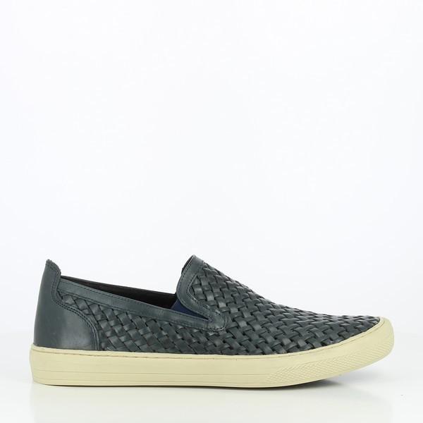 The side view shows the sleek silhouette of the Anatomic Macau Navy Driver Shoe, featuring smooth navy leather with subtle stitching along the edge, and a rounded toe for a classic, streamlined look.