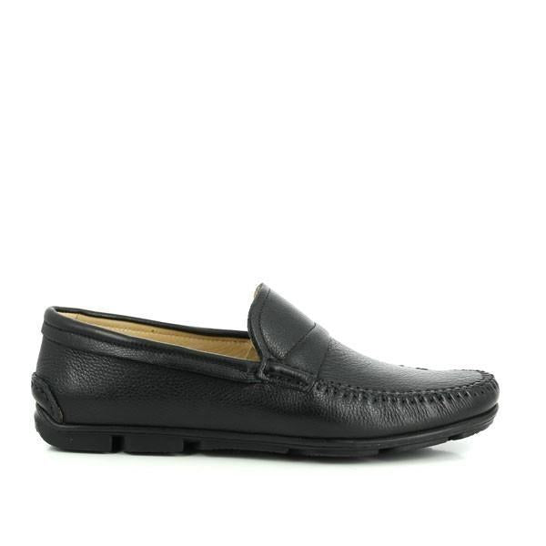 A sleek profile of the Anatomic Olinda Black Driver Shoes, showcasing the smooth leather upper and rounded toe. The minimalist design highlights the elegant stitching along the side.