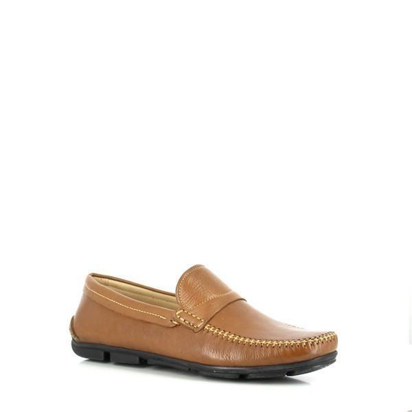 This angled view captures the elegant curvature of the shoe, emphasizing its comfortable design and supple leather. The subtle burnishing of the leather gives the shoes a sophisticated, vintage look.
