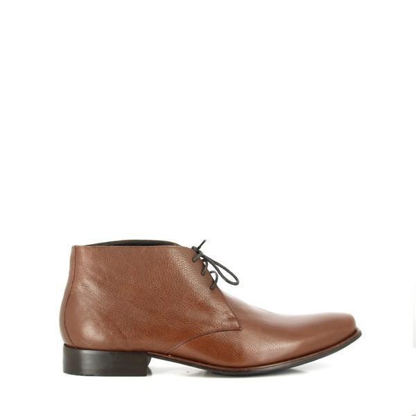 The side view of the Anatomic Panorama Brown Lace-Up Ankle Boots showcases the sleek and smooth leather upper, with fine stitching along the edges. The lace-up design highlights the classic round toe, while the 2cm heel adds a touch of height to the clean, minimalistic silhouette.