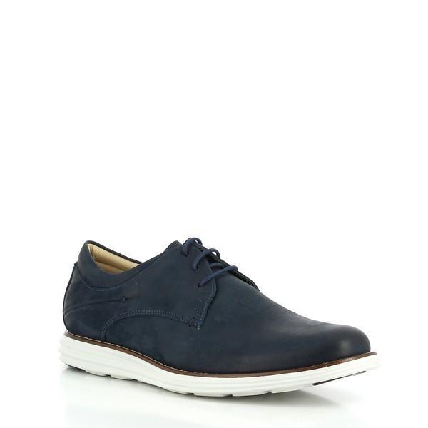 The Anatomic Planalto Navy Trainers displayed at a slight angle to reveal the depth and curvature of the shoe. The angle emphasizes the premium leather material and the subtle stitching details along the sides.
