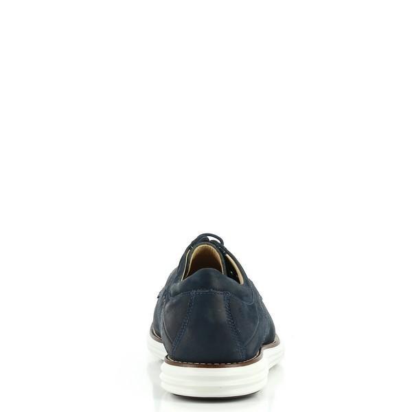 The back view of the Anatomic Planalto Navy Trainers, focusing on the heel and the sleek, clean lines of the design. This perspective highlights the rounded heel and the overall refined look of the trainers.