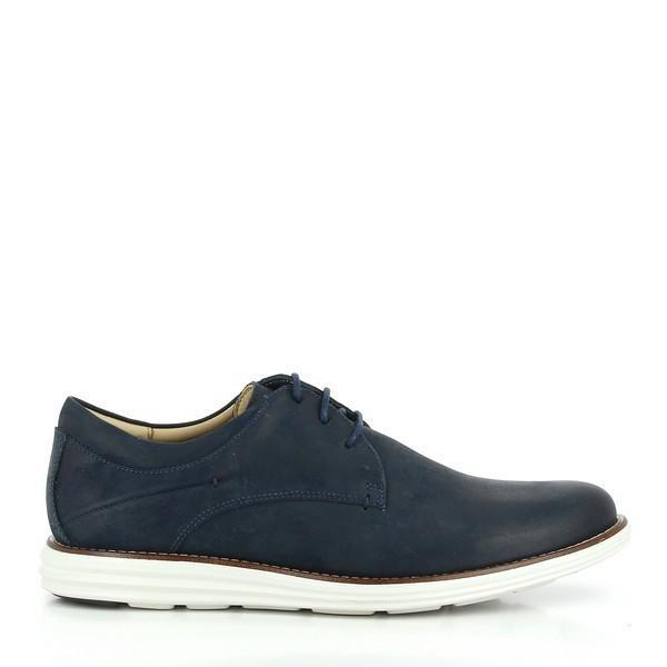 A clear side view of the Anatomic Planalto Navy Trainers, showcasing the smooth, navy leather upper and the clean, rounded toe. The sleek profile highlights the sophisticated design of these men's shoes.