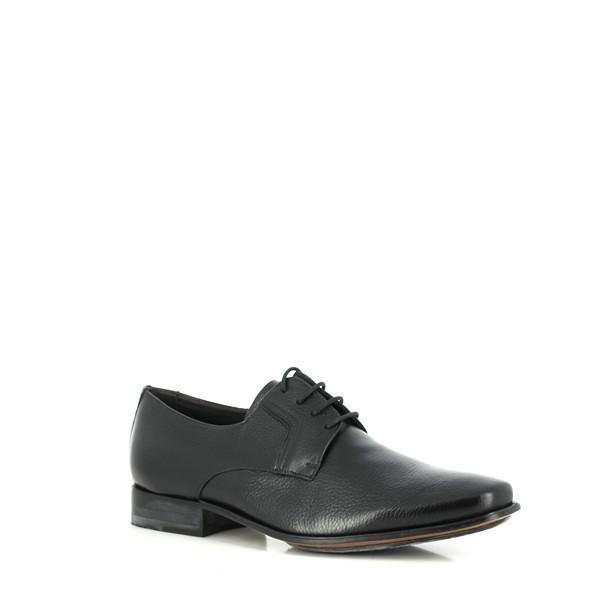 The angled shot reveals the shoe’s subtle shine and sophisticated design, including the rounded toe and slight curve of the heel. The premium leather upper and refined finish are clearly visible.