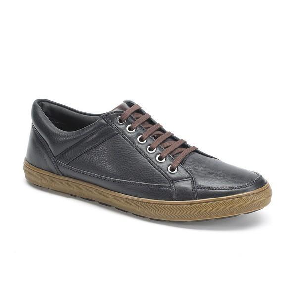 This angled view captures the shoe's depth and structure, emphasizing the rounded toe and comfortable fit. The subtle sheen of the leather and the precision of the craftsmanship are evident, offering a glimpse of the sneaker’s overall profile.