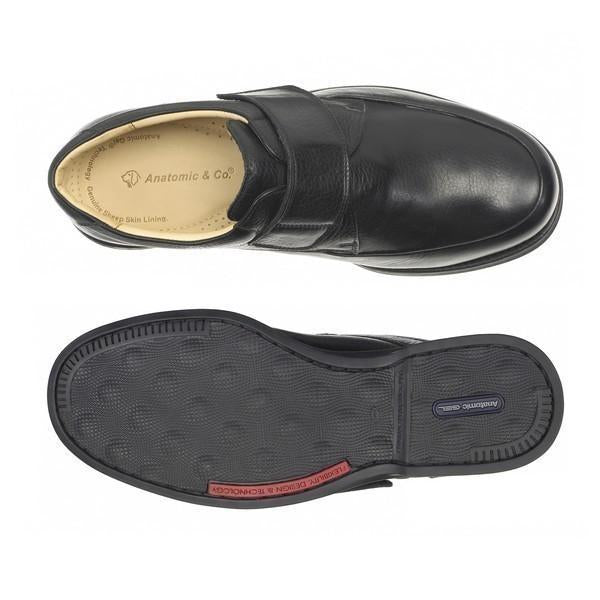 One shoe is upright, revealing the soft, rounded toe and streamlined shape from above, while the other is upside down to showcase the sole. The rubber sole features non-slip patterns, emphasizing both comfort and durability.