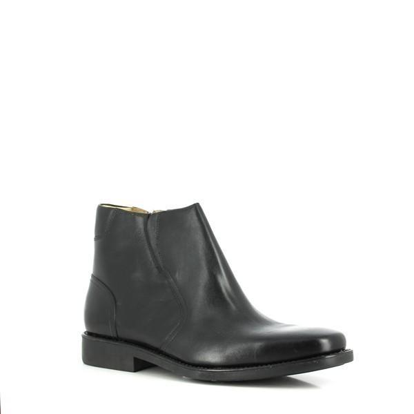 The shoe is displayed at an angle, showcasing its sharp silhouette. The curve of the arch and heel provide a glimpse of the sturdy, non-slip sole. The leather upper gleams under soft lighting, highlighting the craftsmanship.