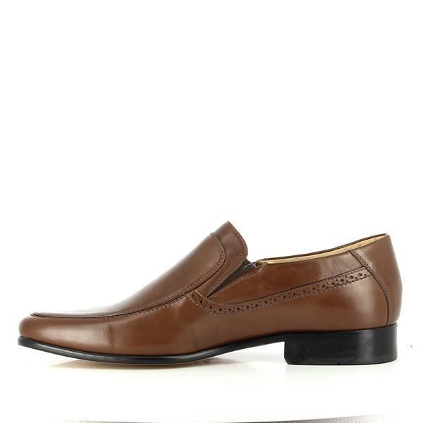 The internal side of the shoe is displayed, revealing the plush sheepskin lining and cushioned footbed. This angle highlights the high-quality leather and the meticulous attention to detail in the interior construction.
