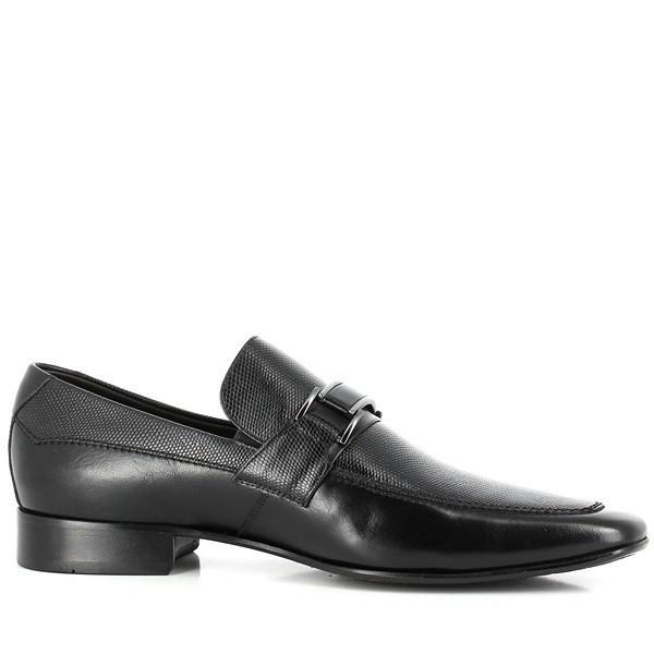 The photo captures the sleek, side profile of the Anatomic Welt Black Driver Shoes. The smooth, supple leather upper is showcased with its refined finish, highlighting the elegant round toe shape and the soft leather welt detailing. The clean lines of the shoe convey a classic yet contemporary style.