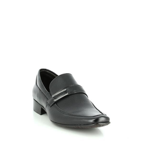The Anatomic Wyting Black Driver Shoes are captured from a slight angle, emphasizing the elegant curvature of the leather upper and the soft, rounded toe. The photo reveals the refined burnished detail and the flexible rubber sole enhanced with Anatomic Gel Technology®. The subtle heel height and cushioned footbed add to the shoe's stylish yet comfortable design.