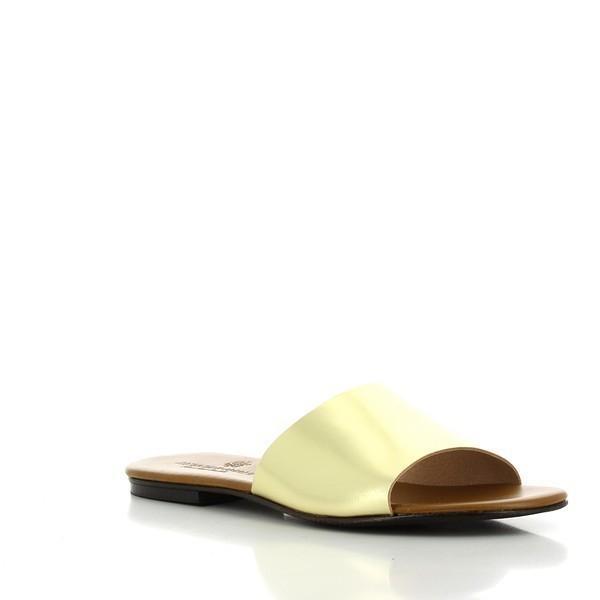Captured from a slight angle, this perspective showcases the slide's rounded toe and subtle 1cm heel, providing a clear view of the contours that create a flattering look on the foot. The gold hue stands out, making it a perfect accessory for various outfits.